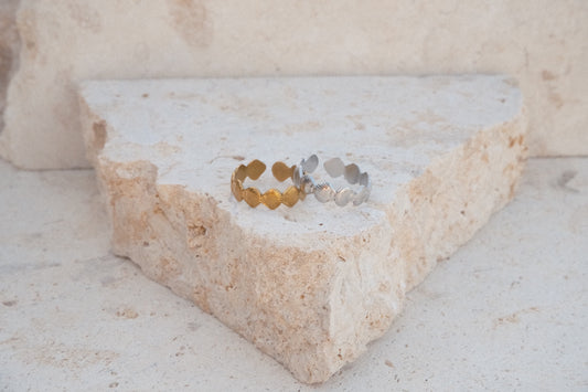 Two rings on a textured stone surface