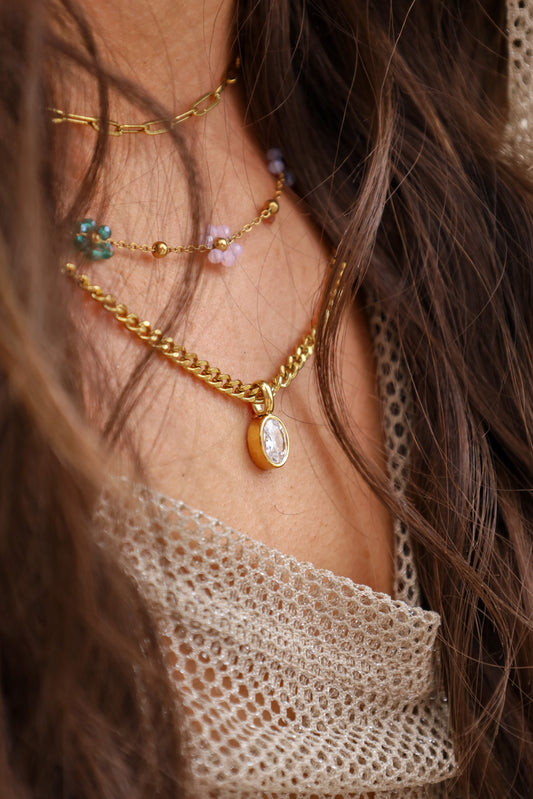 Sol & Aura - ABI Necklace on woman wearing mesh top and long brown hair