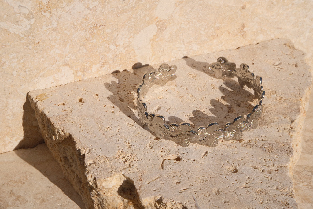 Clear glass bracelet on a textured stone surface