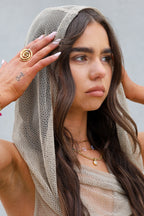 Sol & Aura - ESSIE Ring on womans hand in mesh hooded top against grey background