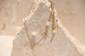 Sol & Aura - Pearla Bracelet - 4 natural pearls on bracelet on thin gold chain on stone surface