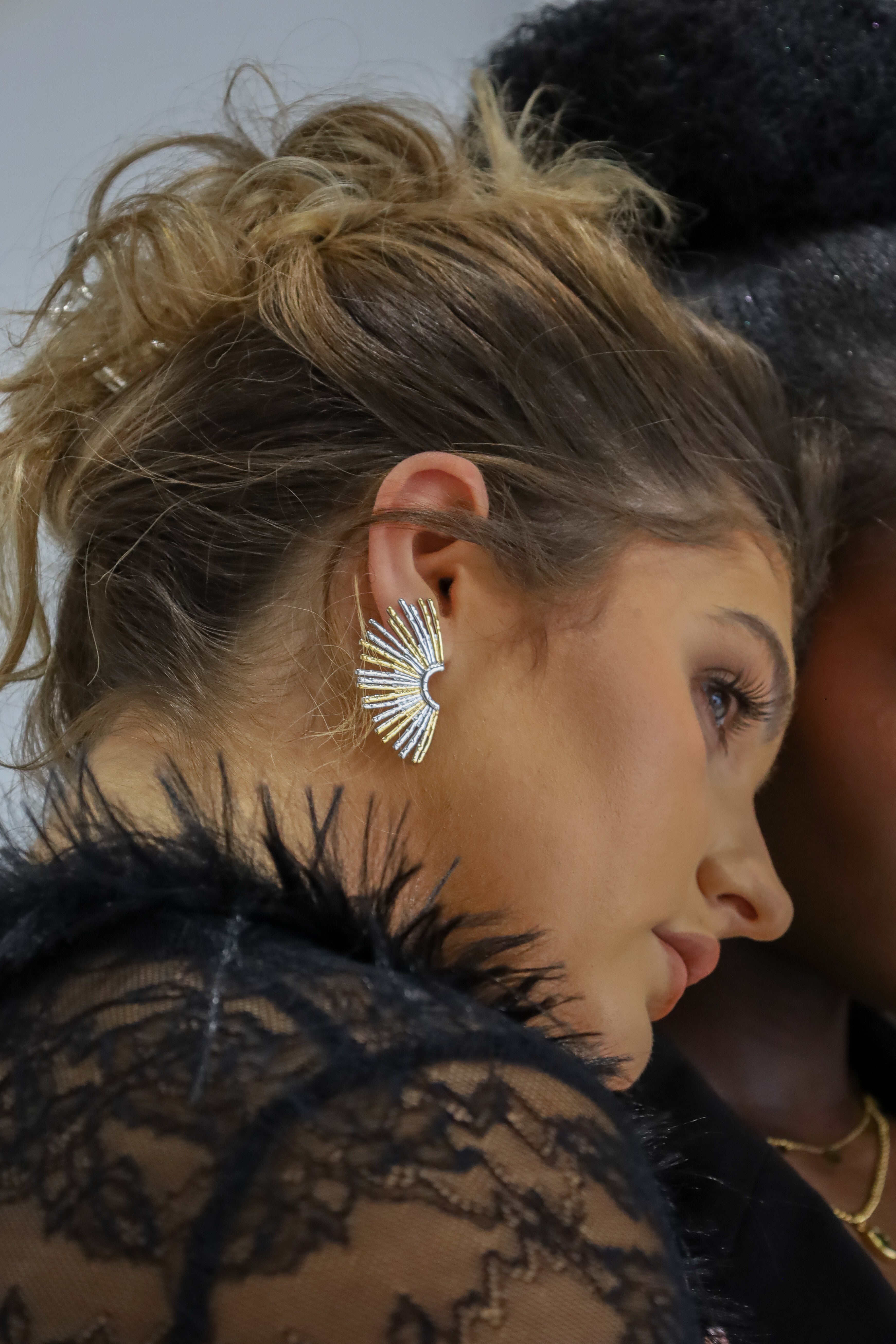 Sol & Aura - Ray Earrings worn by woan in black lace top with hair up