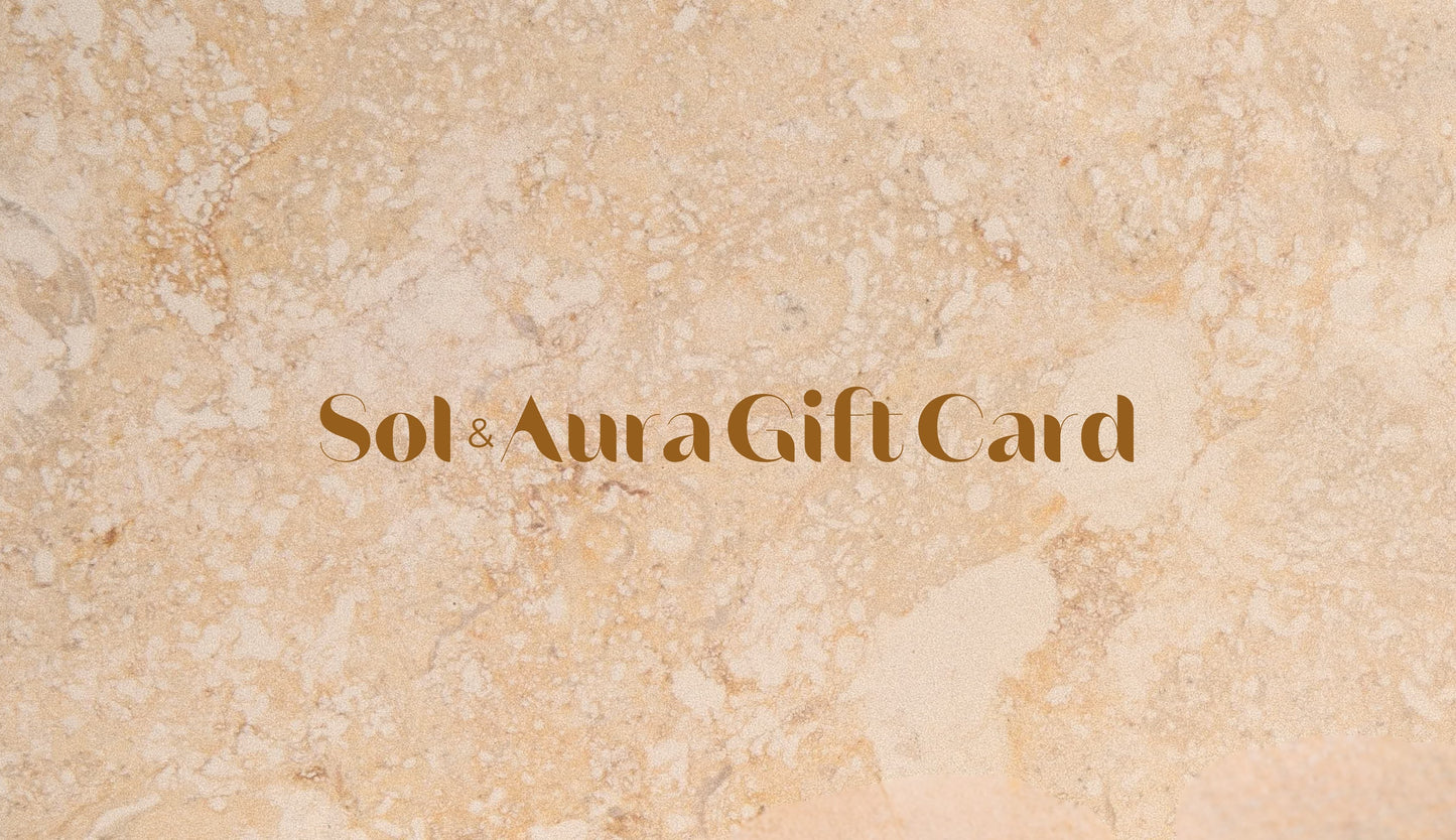 Gift card with 'Sol & Aura' text on a beige marble background